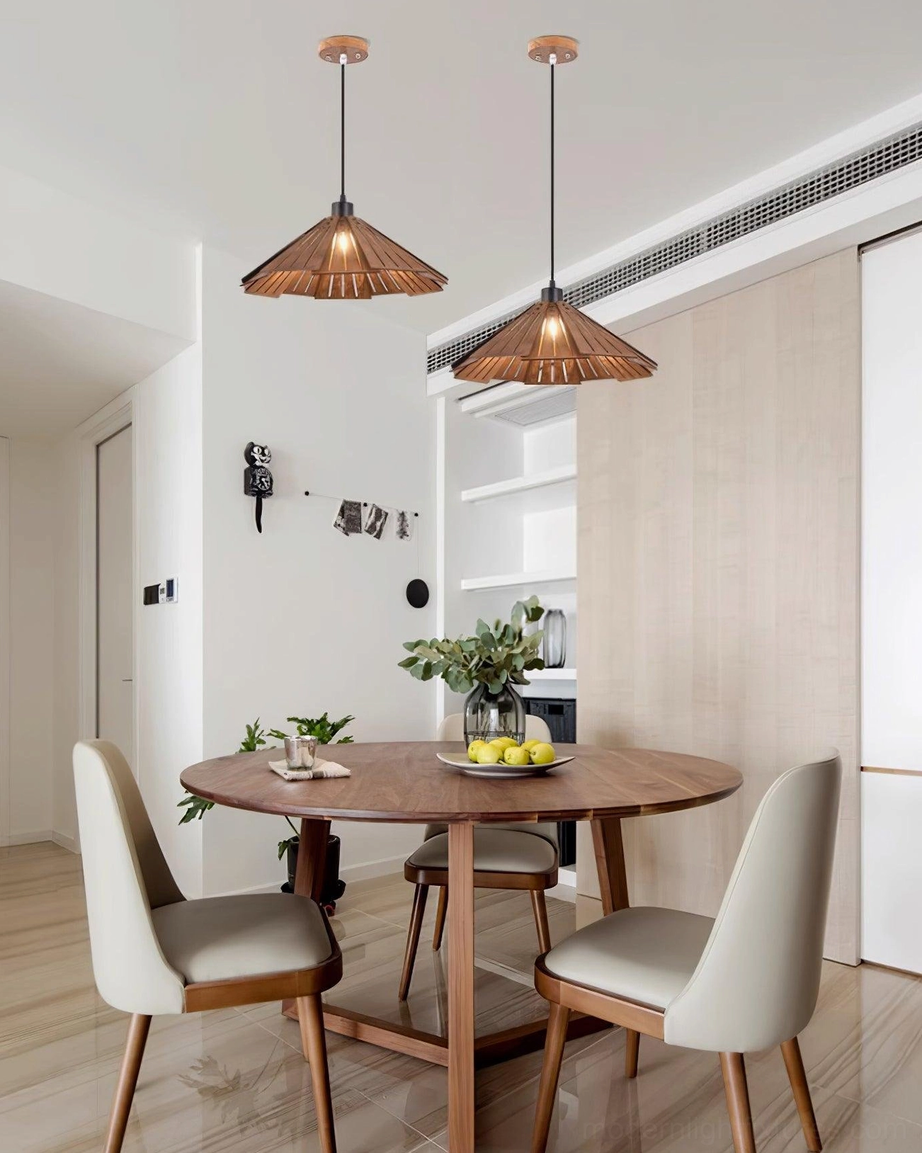 Delfina wooden pendant lamp paired with modern chair and minimal furnishings