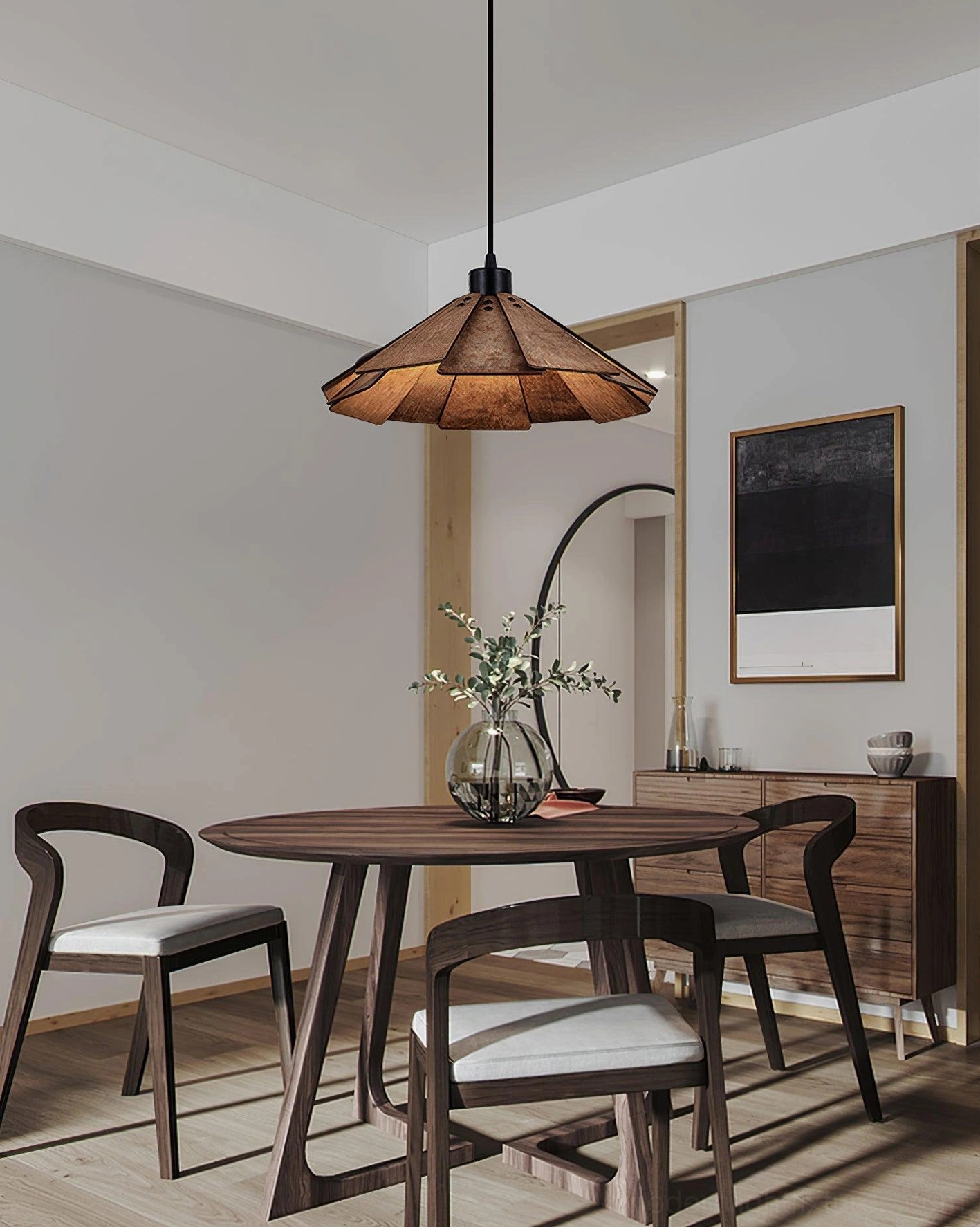 Delfina wooden pendant lamp suspended over round dining set in warm minimalist apartment