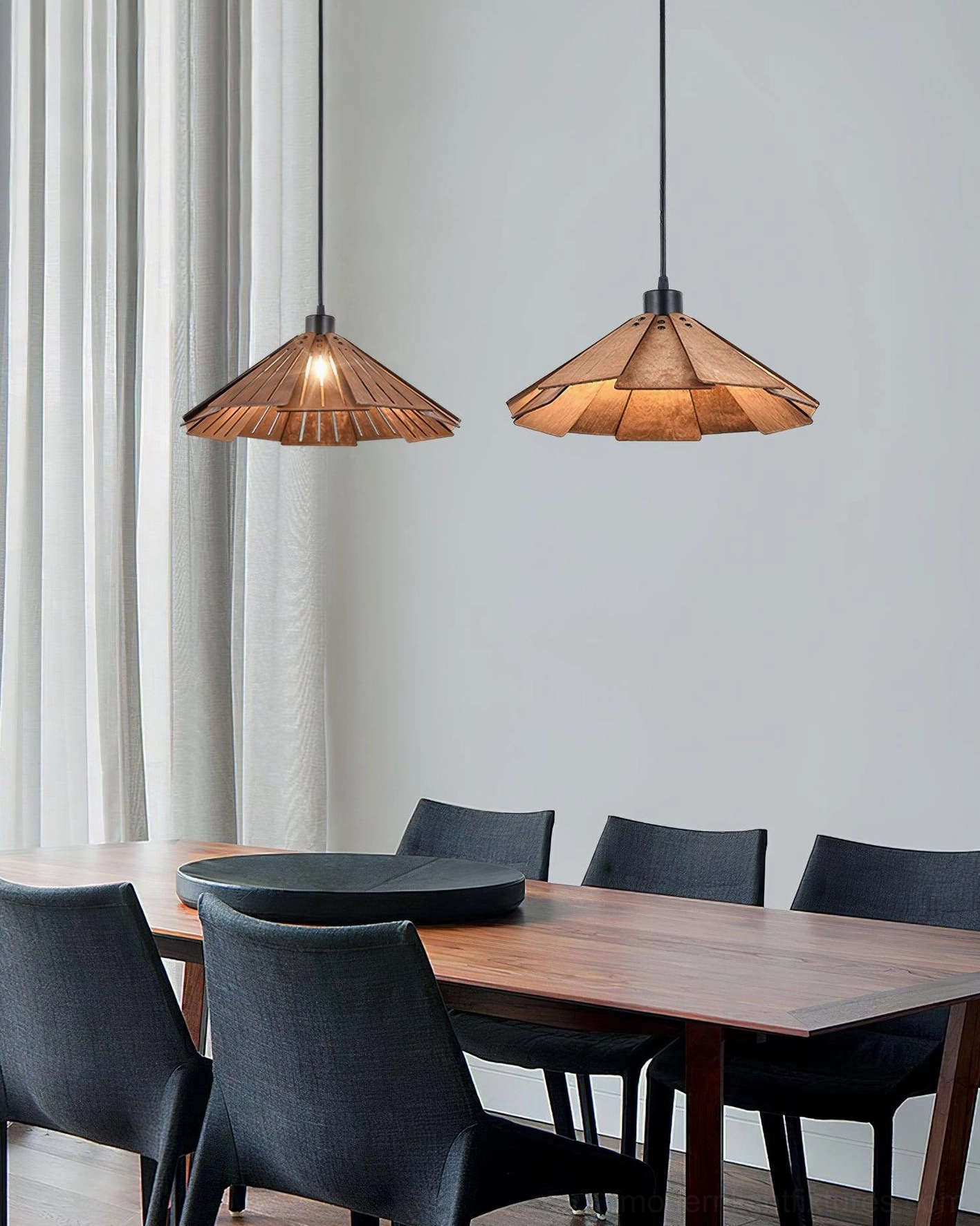 Two matching Delfina wood pendant lamps with brown conical shade in modern dining space