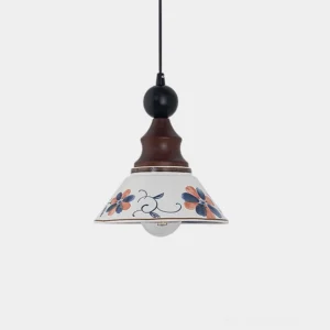 Hand-painted delft ceramic pendant light with floral folk art motifs on conical shade, wood and metal accents, front view on white background