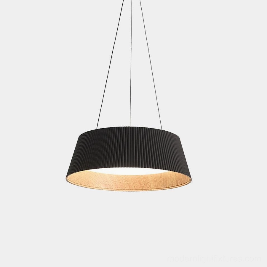 Delta pleated drum pendant light with black fabric shade and wood interior trim, front view on white background