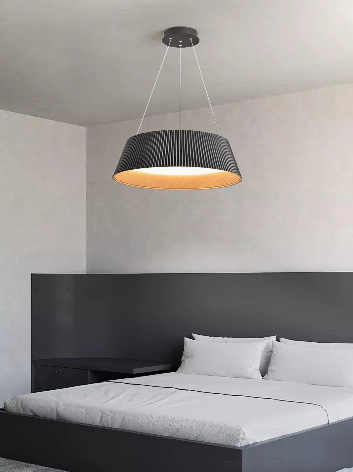 Delta pleated pendant lamp showing geometric design and professional installation in residential setting