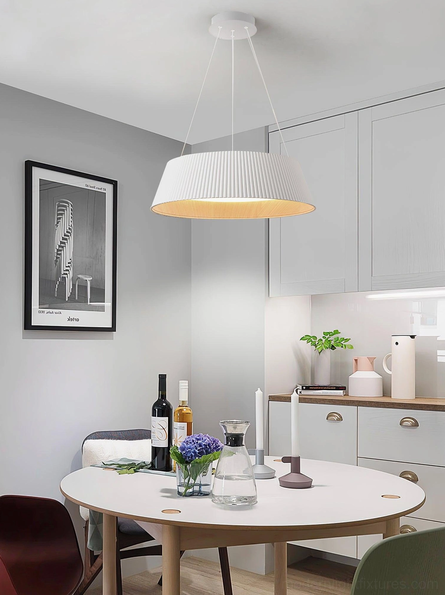 White Delta pleated pendant lamp in modern kitchen-dining area with decorated table setting