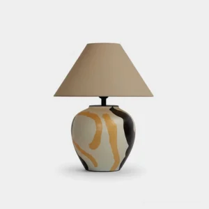 Desert Swirl hand-painted ceramic table lamp with tapered fabric shade and swirled glaze decoration on white background, front studio view