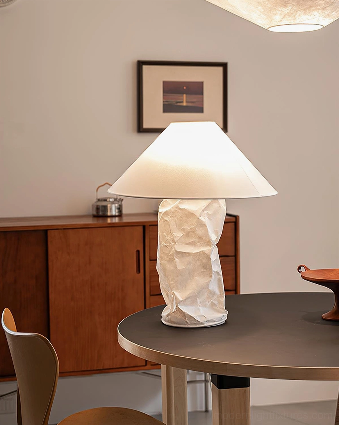 White DuPont paper table lamp with contemporary design in styled home interior
