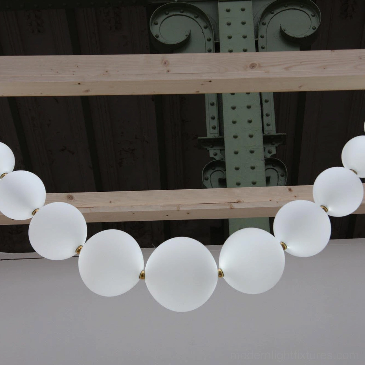 Luxury pearl chandelier creating designer lighting moment in high-end residential interior