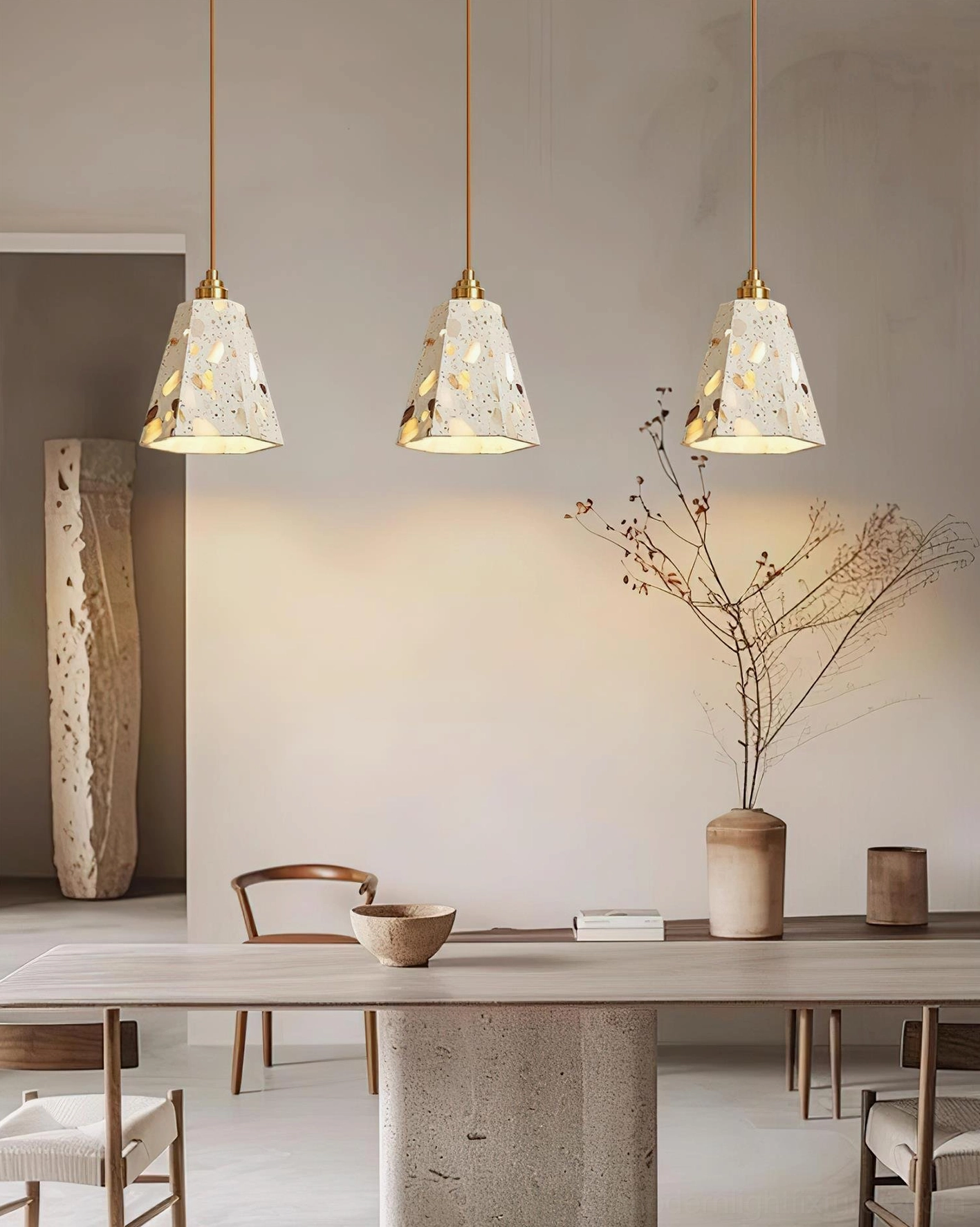 Designer terrazzo pendant lamp with brass accents in contemporary home decoration
