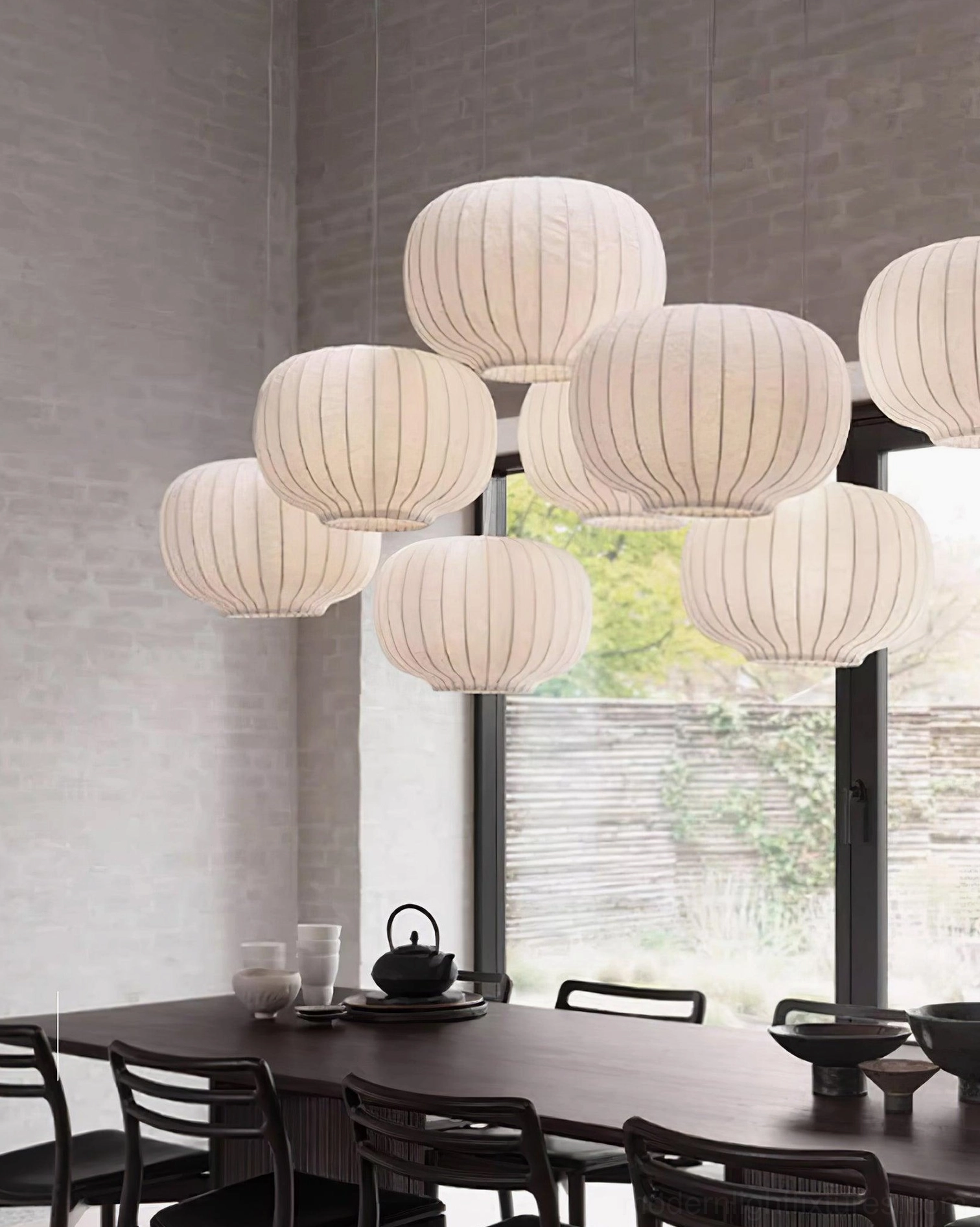 Modern white fabric pendant light installed in designer dining space with minimalist aesthetic