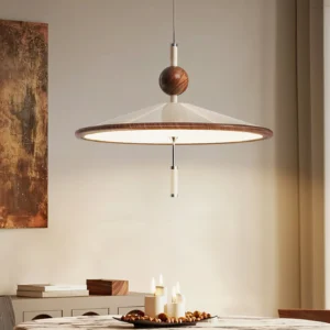 Devon pendant light installed above formal dining room table creating warm ambient lighting