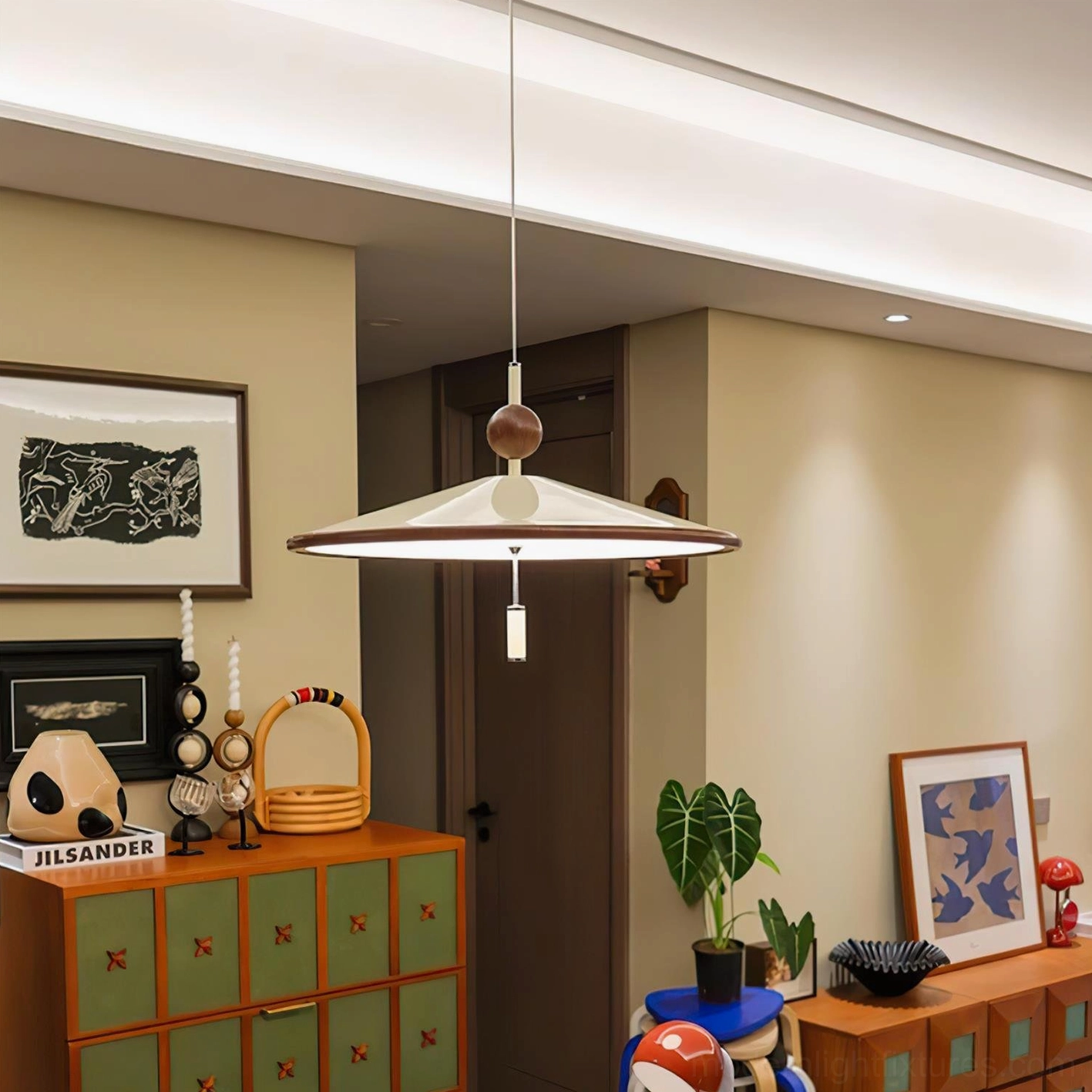 Devon mid-century modern pendant light in living room with vintage wooden furniture and decorative accents