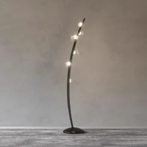 Contemporary floor lamp with warm glowing light and sleek arc design, side view in modern living space