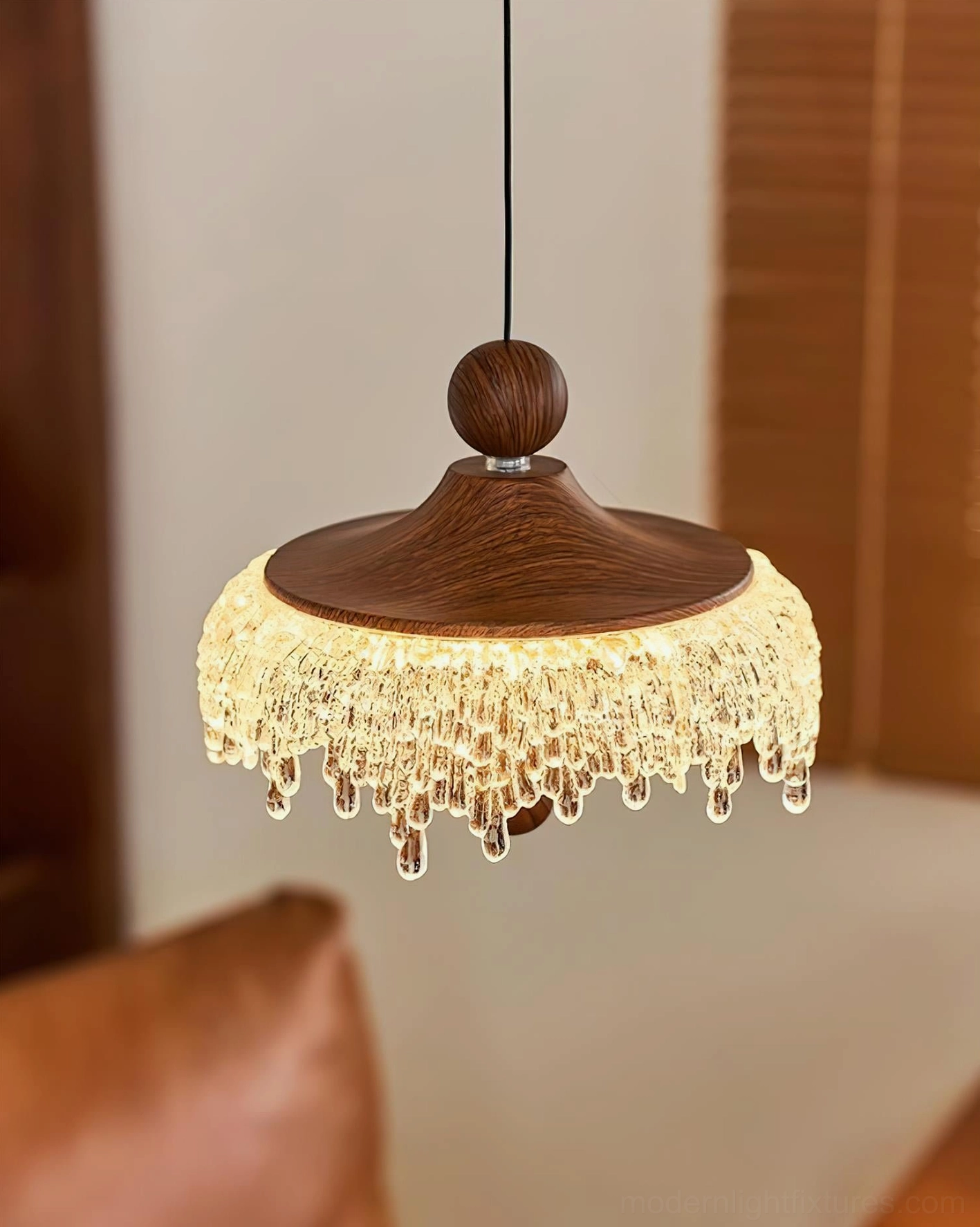 Dewdrop Halo pendant light illuminated from below, full glass droplet shade visible