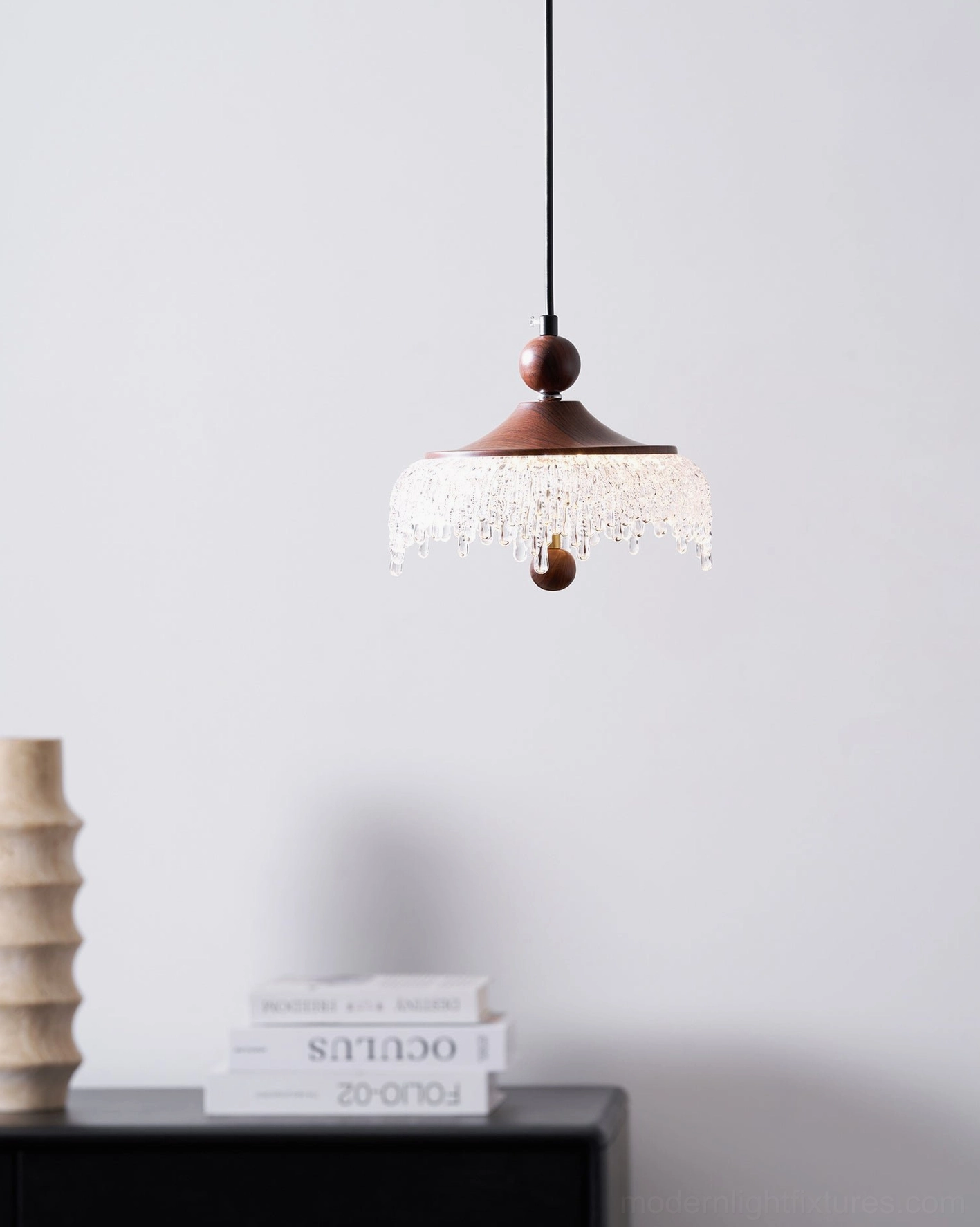 Compact Dewdrop Halo pendant light with warm LED illumination, overhead side view