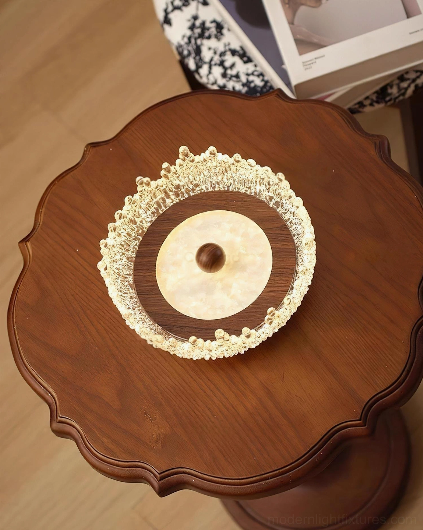 Contemporary Dewdrop Halo LED lamp centered on vintage wooden table with warm ambient lighting