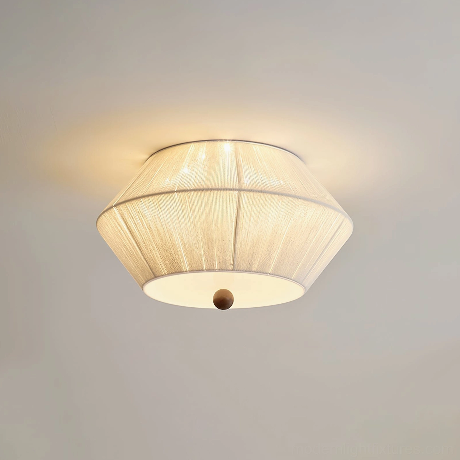 Soft diffused illumination from contemporary tapered fabric flush mount ceiling light in neutral interior