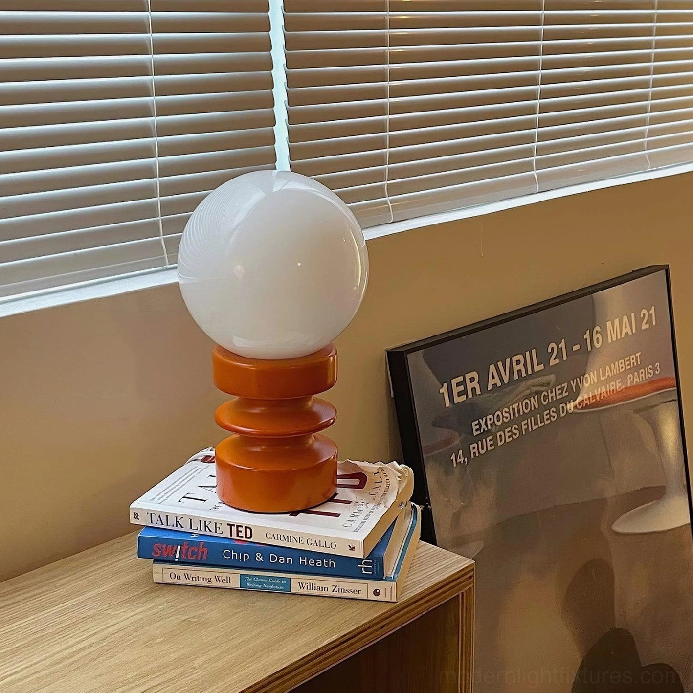 Wood and glass table lamp with diffused frosted shade for ambient home lighting