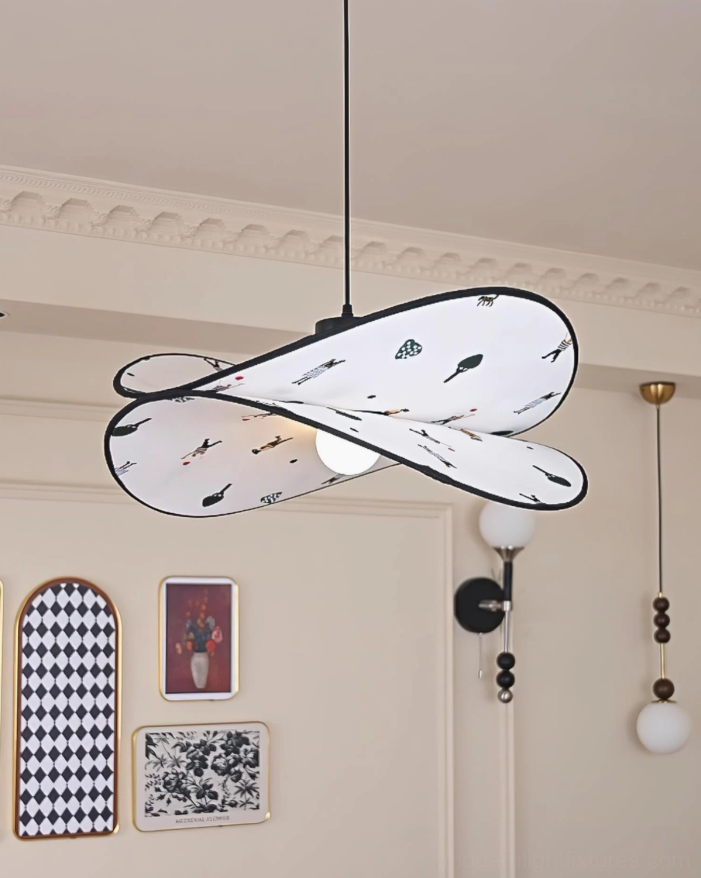 Artistic pendant light in residential entryway with wall art, twisted petal design with exposed interior bulb