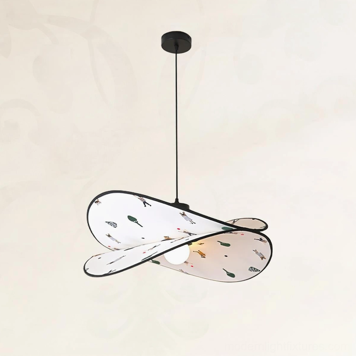 Compact fabric pendant lamp with twisted petal silhouette and playful interior print, side angle view