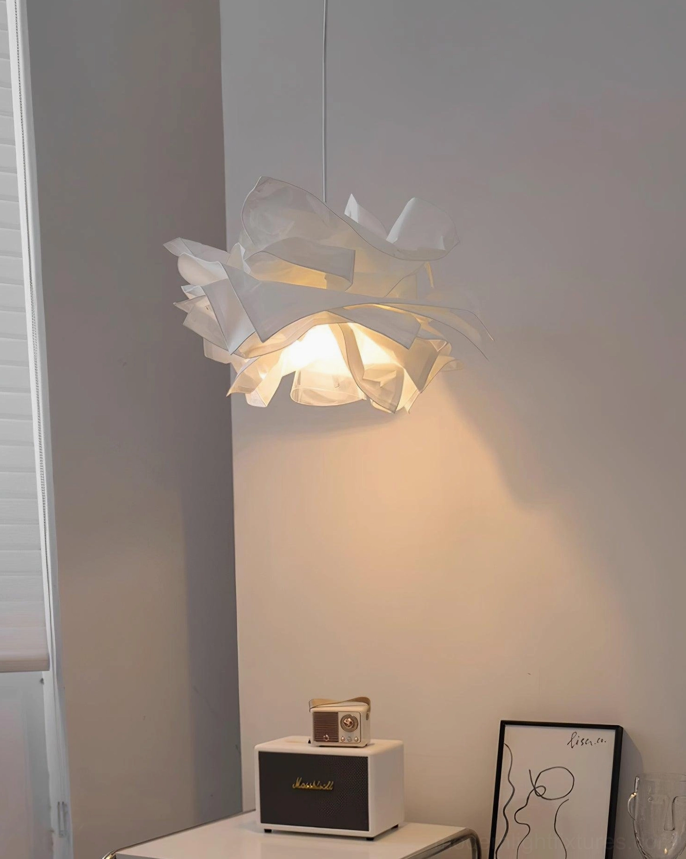 Contemporary paper pendant lamp with folded paper design creating visual interest and dimension