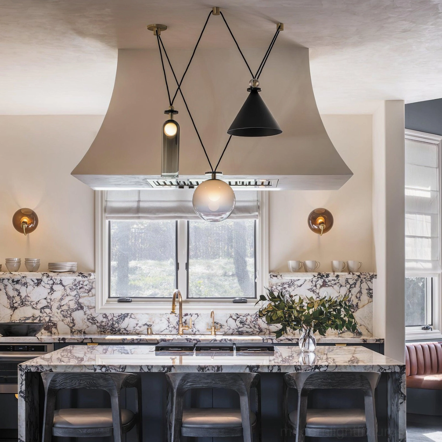 Dimmable geometric pendant chandelier with adjustable cable height above dining table mid-century modern
