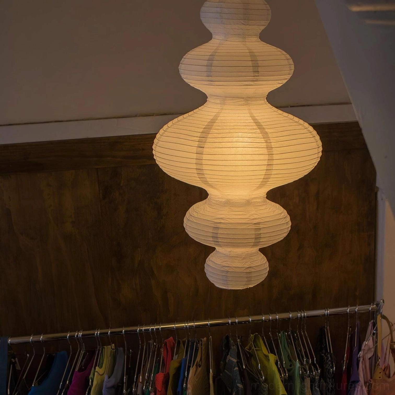 Dimmer-compatible white pendant light illustrating soft ambient mood with reduced brightness setting