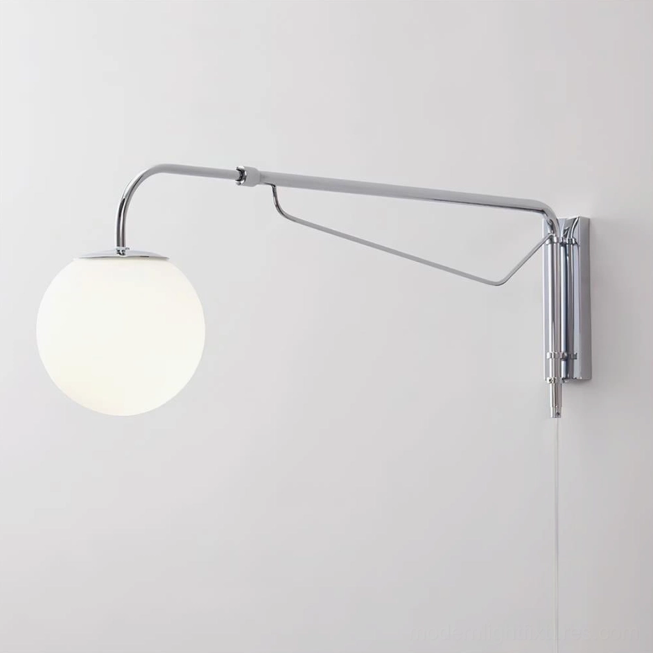 Modern Dione adjustable wall sconce front view showing spherical frosted glass shade and polished chrome finish