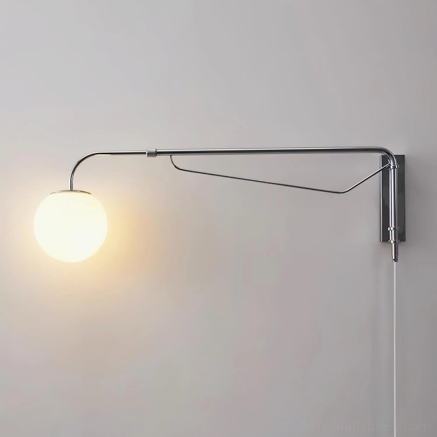 Dione swing arm wall lamp illuminated warm light frosted acrylic globe ambient lighting close-up