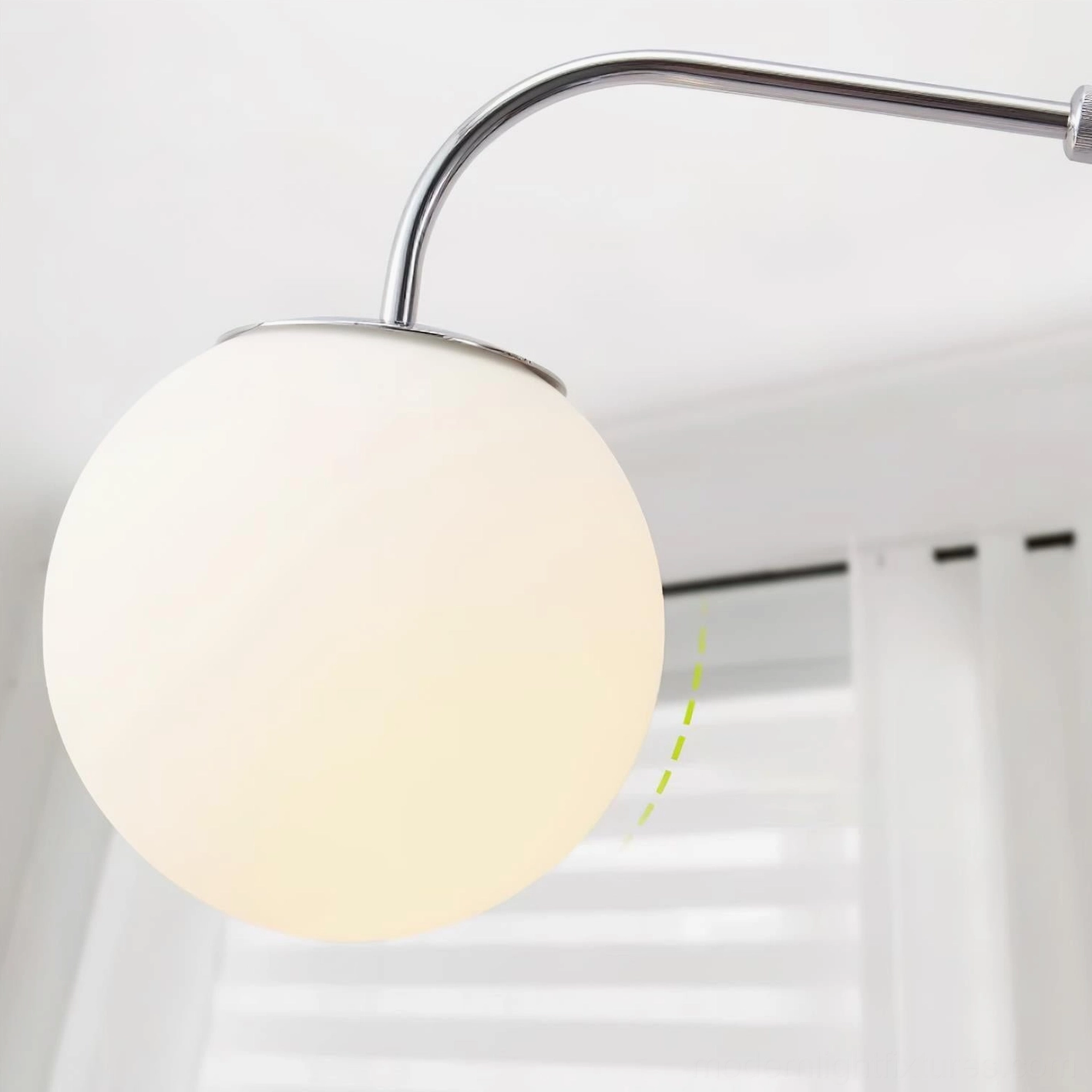 Dione adjustable wall sconce side profile showing articulation mechanism chrome finish