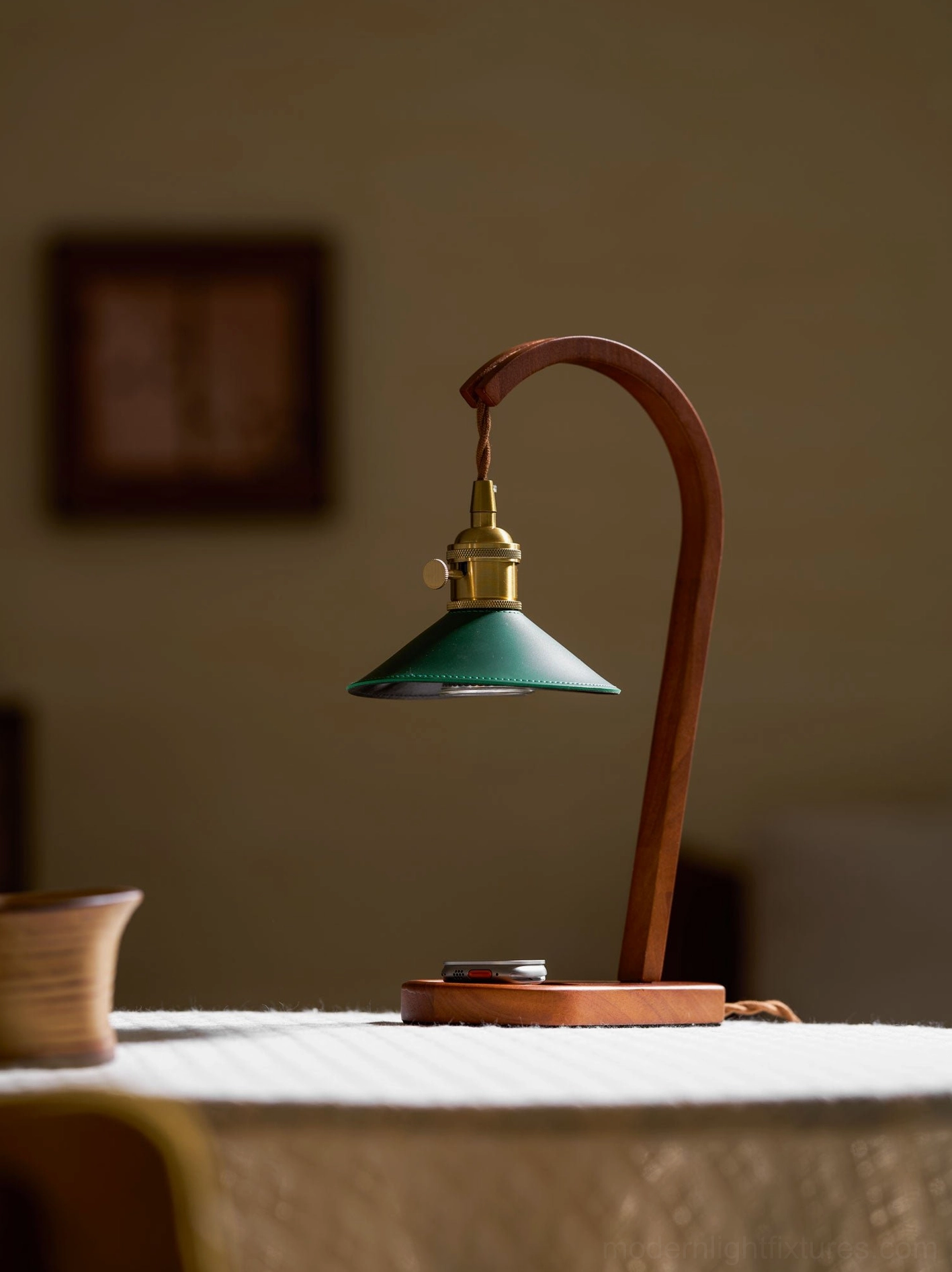 Diosa candle warmer lamp minimalist setting with green metal shade and wood arm detail