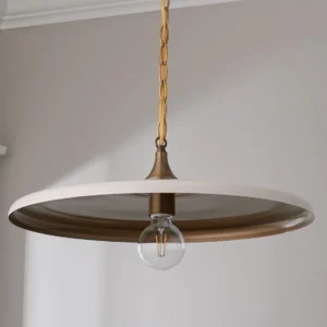Contemporary disc pendant lamp with two-tone gold and white metallic finish installed in residential interior