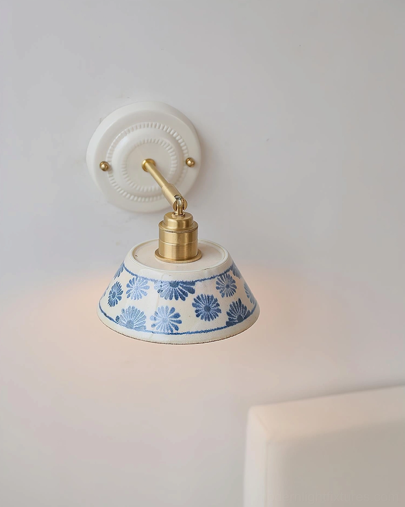 Hand-glazed ceramic wall lamp with distinctive indigo patterns and sculptural white base