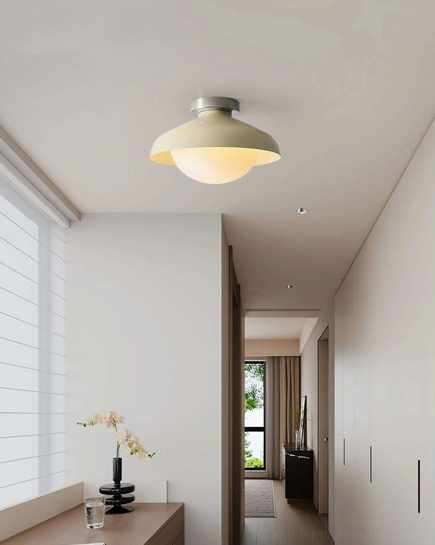 Contemporary dome ceiling fixture with cream beige shade in warm minimalist hallway, residential home corridor lighting
