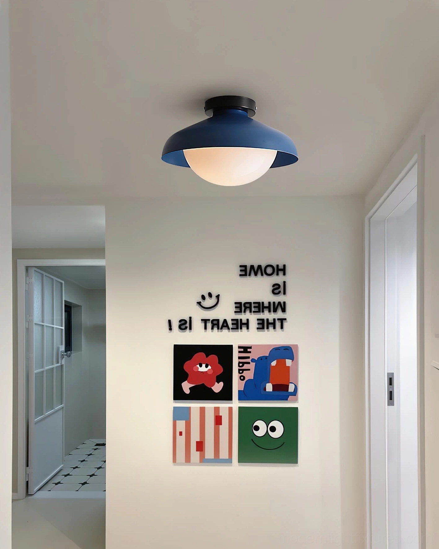 Minimalist dome ceiling fixture with navy blue shade in residential entryway, contemporary home entrance lighting