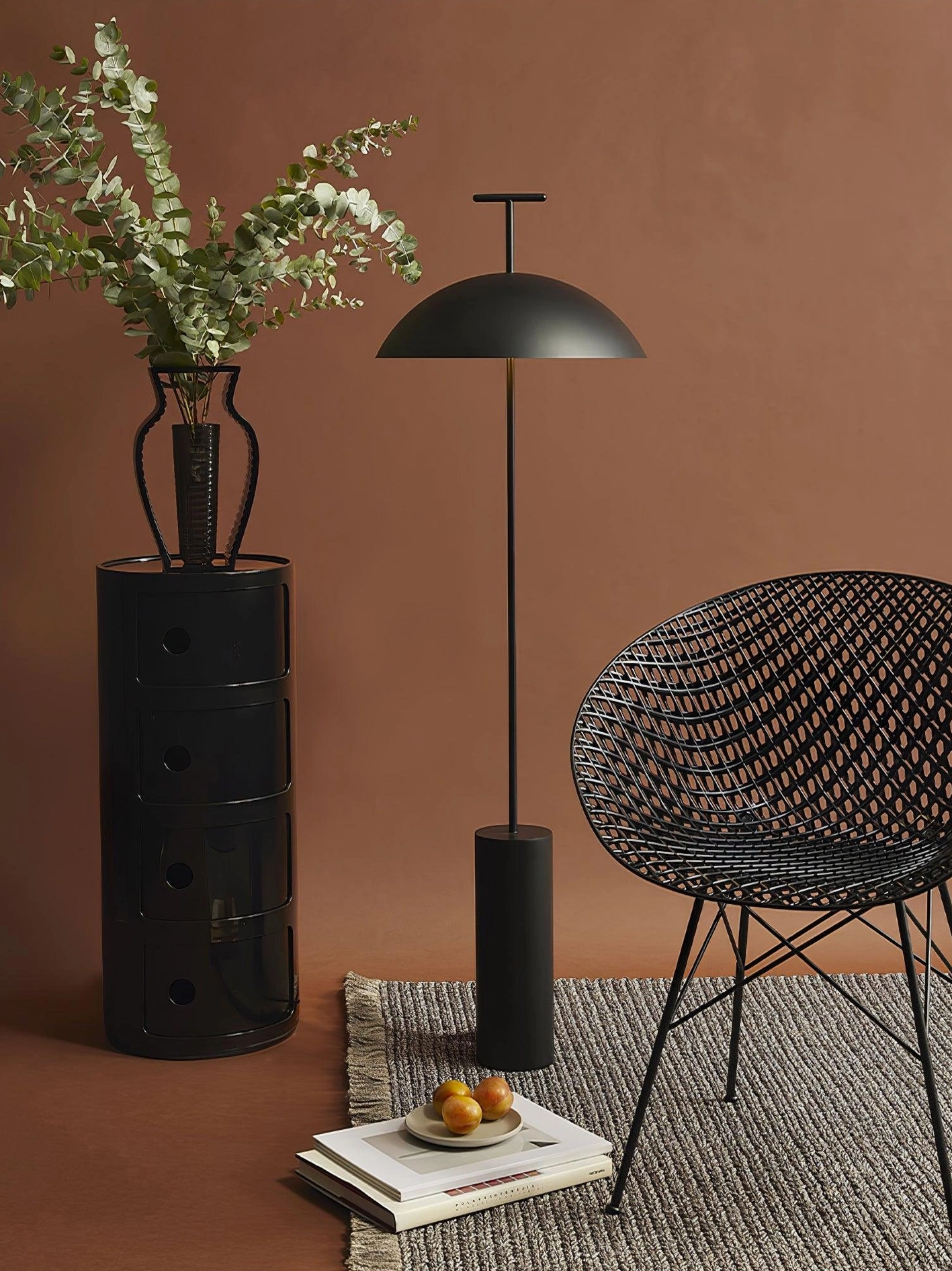 Minimalist dome floor lamp in warm terracotta corner with contemporary furniture styling