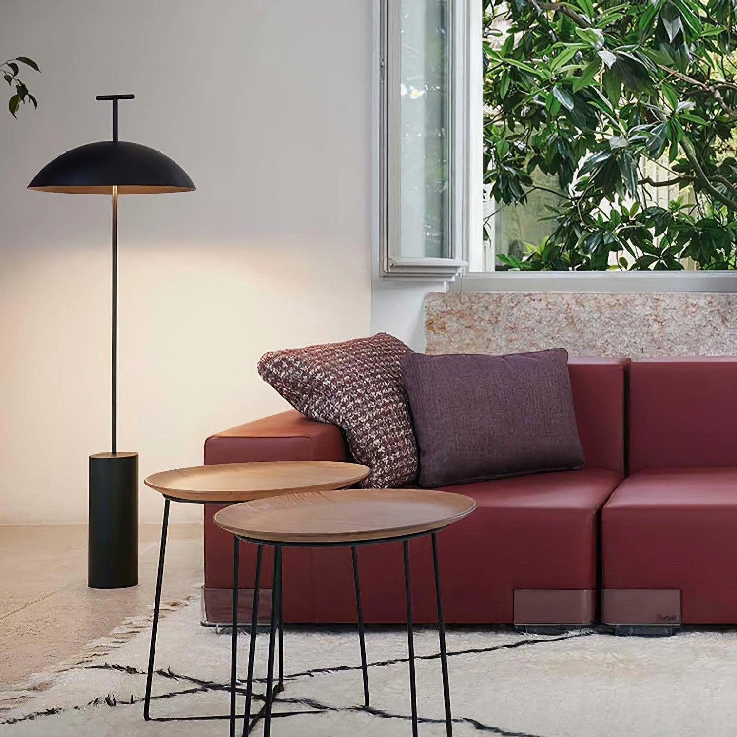 Dome floor lamp beside red sofa in modern living room creating warm ambient atmosphere