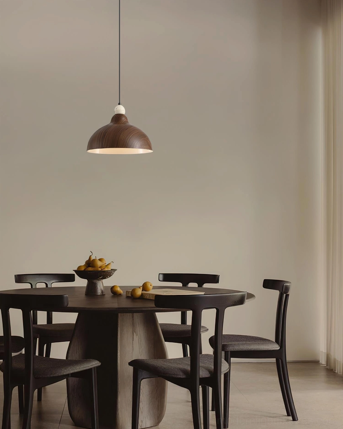 Compact dining area with walnut dome pendant light above wood table and chairs