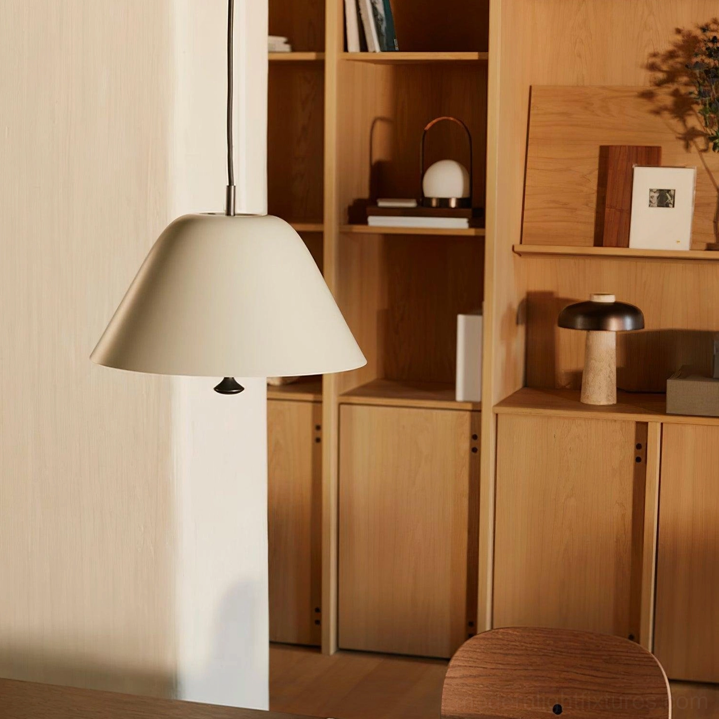 Dome pendant light in open concept living space defining dining zone with focused lighting
