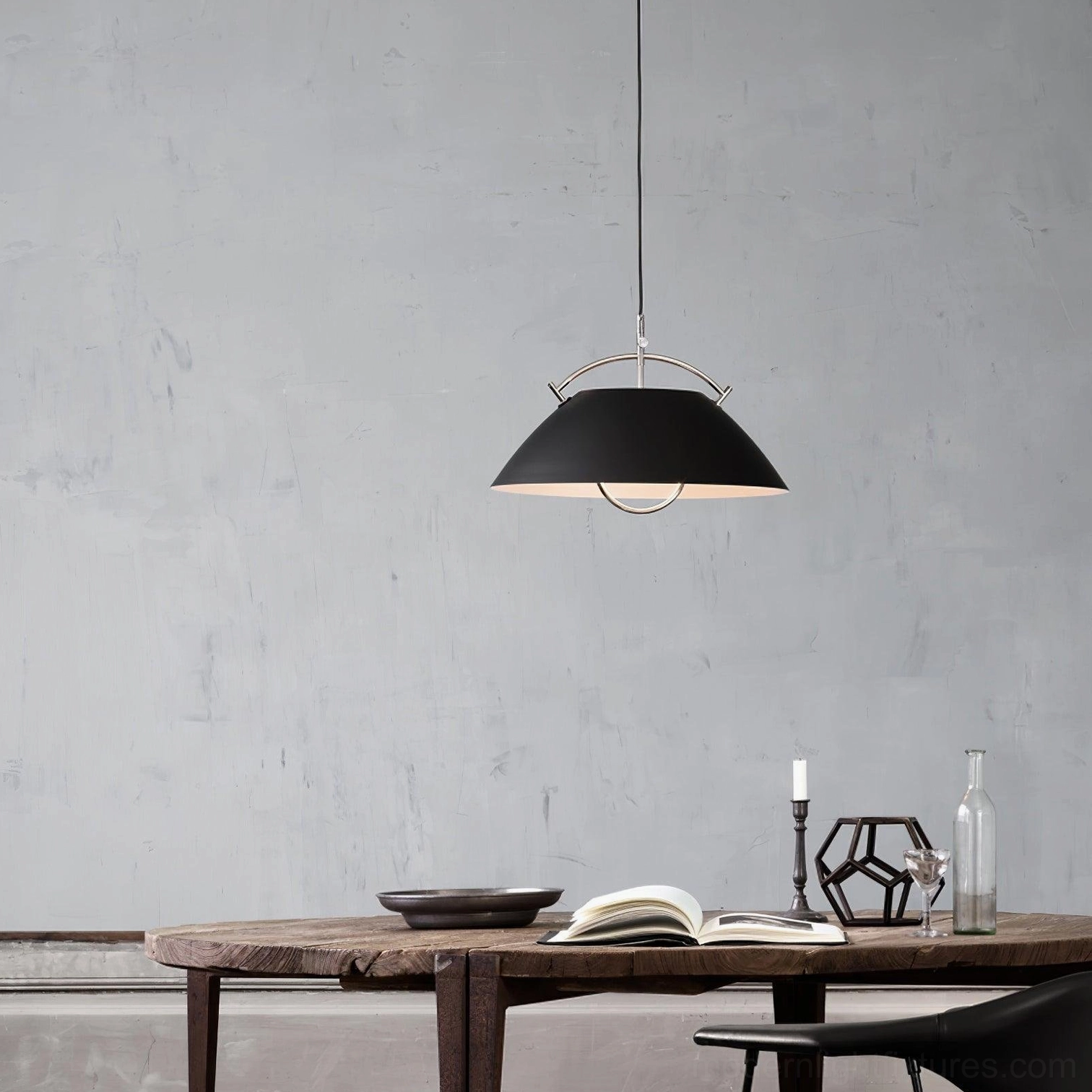 Overhead view of matte black aluminum dome pendant light with curved suspension frame