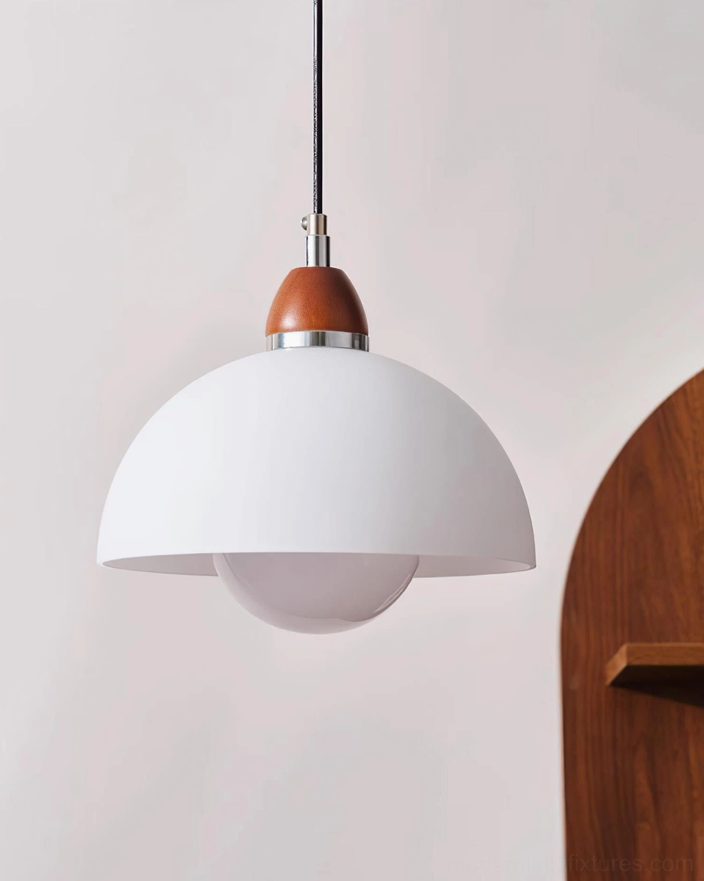 Domed pendant lamp installed in residential setting, showcasing warm ambient lighting and modern interior styling