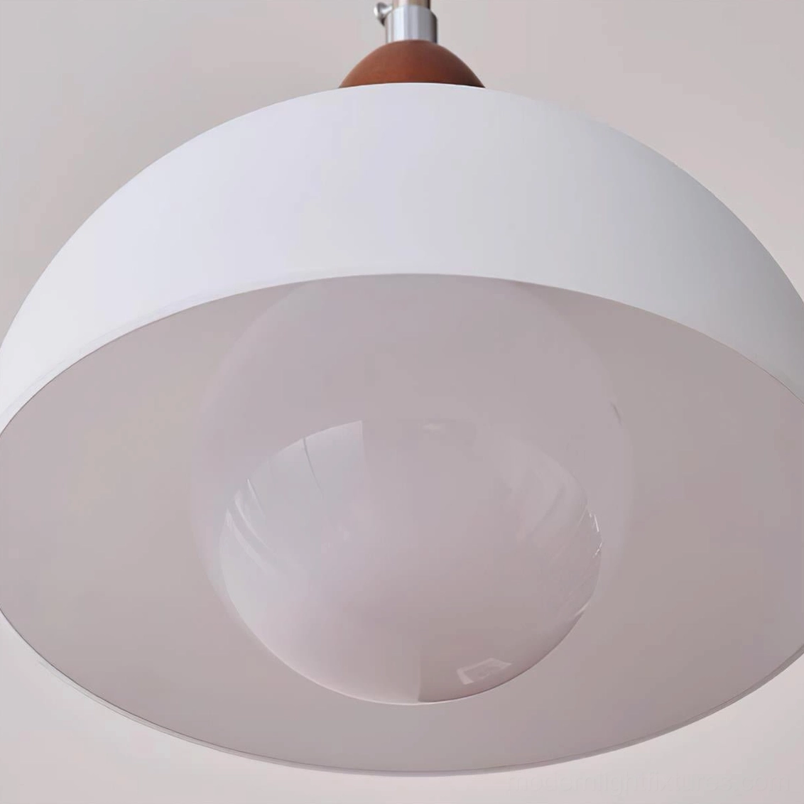 Domed pendant light with adjustable cord, showing suspension hardware and glass shade installation detail