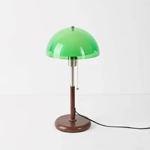 Domera table lamp three-quarter view showing metal stem and green acrylic shade with power cord