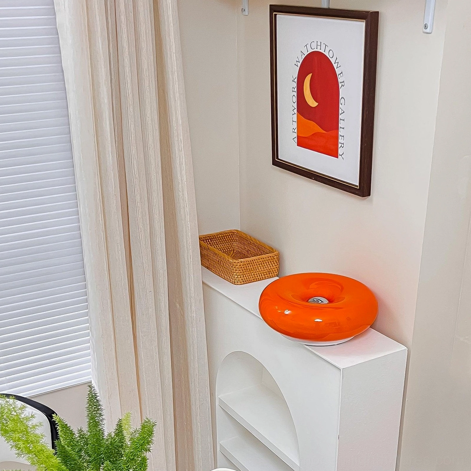 Warm glowing donut table lamp creating cozy ambient lighting in contemporary interior space