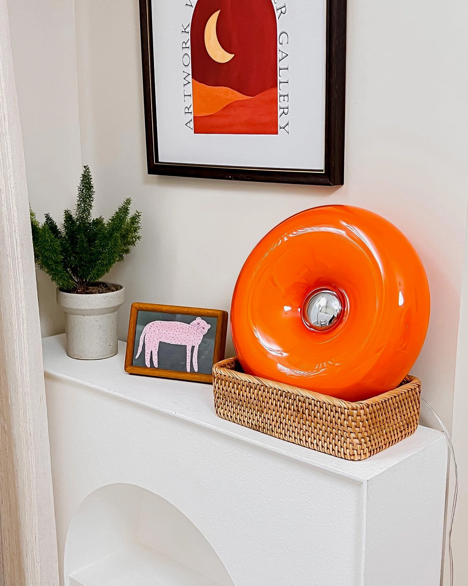 Warm orange donut lamp complements eclectic bohemian scandinavian modern décor styles
