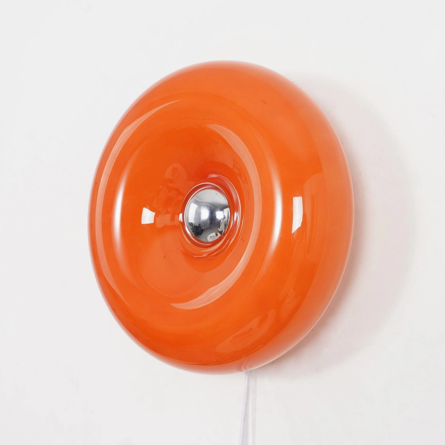 Orange donut wall sconce with three-color adjustable LED, multiple installation angle view