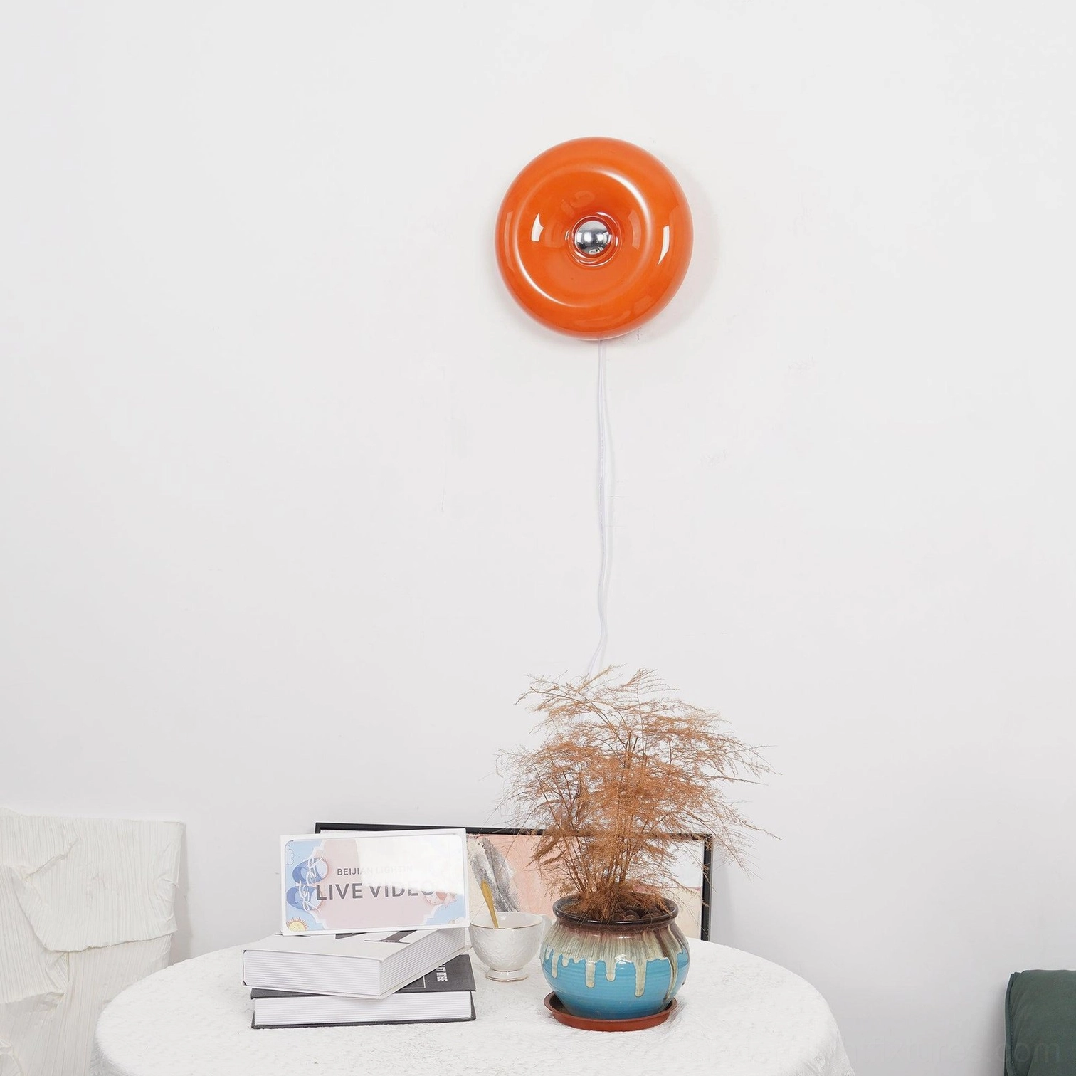 Retro orange donut wall sconce showing three-color changing LED capability with color-adjustable glow