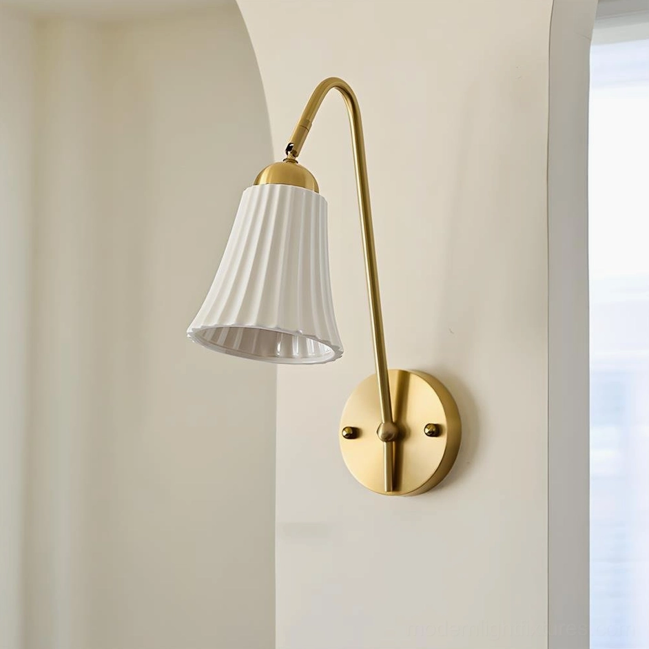 Dorelia pleated fabric wall sconce side product view showing white ribbed ceramic shade and brass hardware