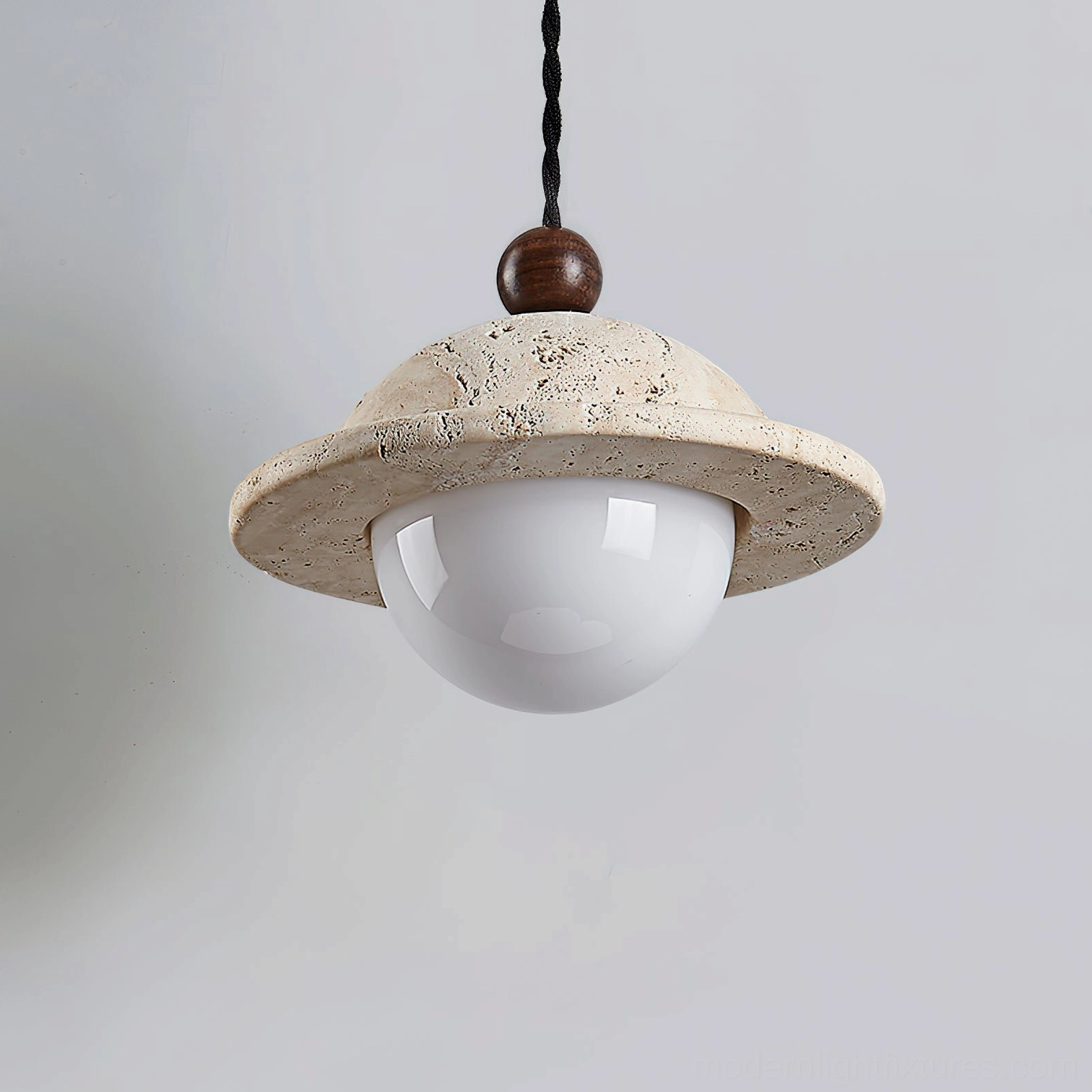 Dorna travertine pendant lamp bottom view showing natural stone texture and opal glass sphere unlit