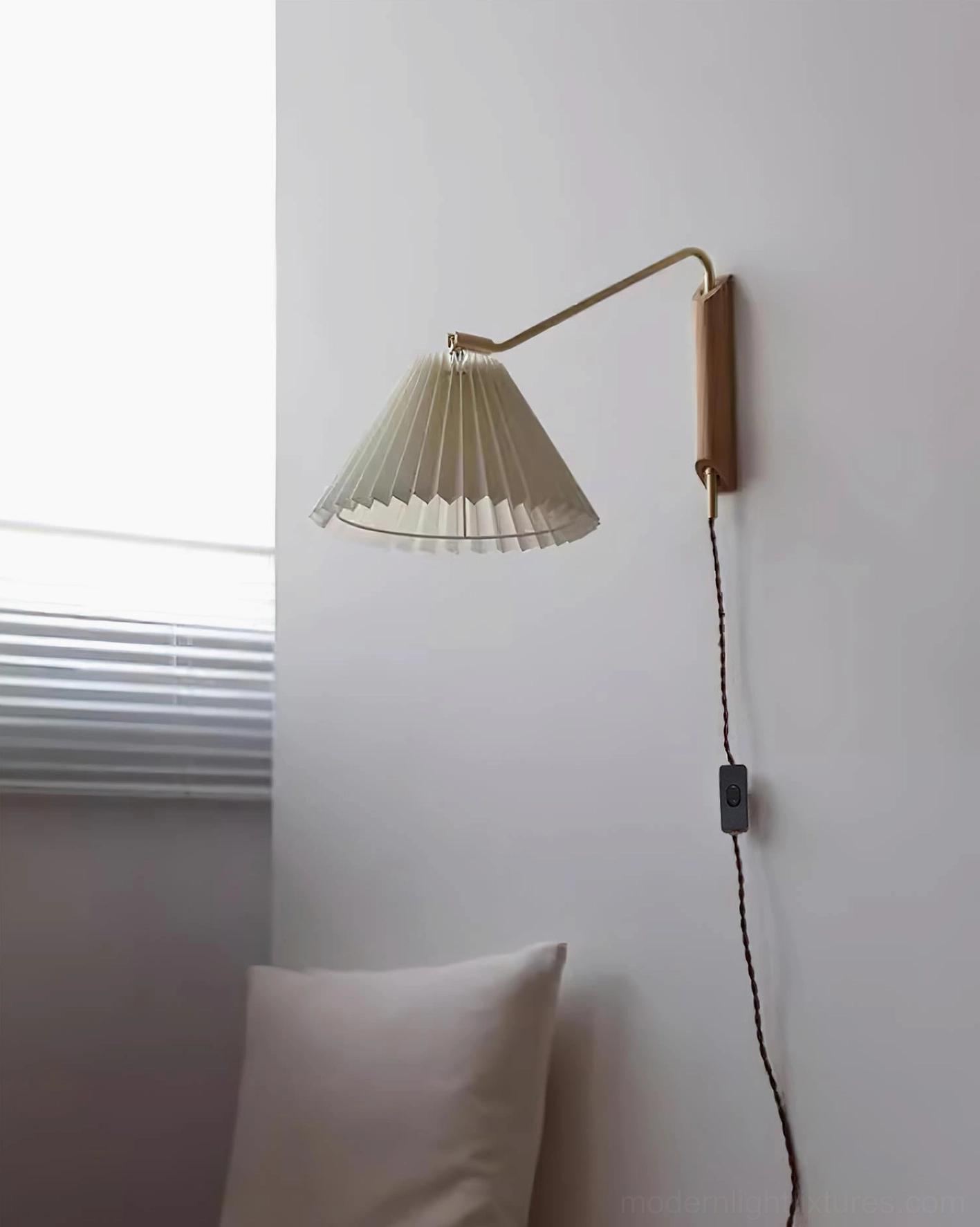 Dorset wall lamp showing adjustable arm rotation capability for lighting angles