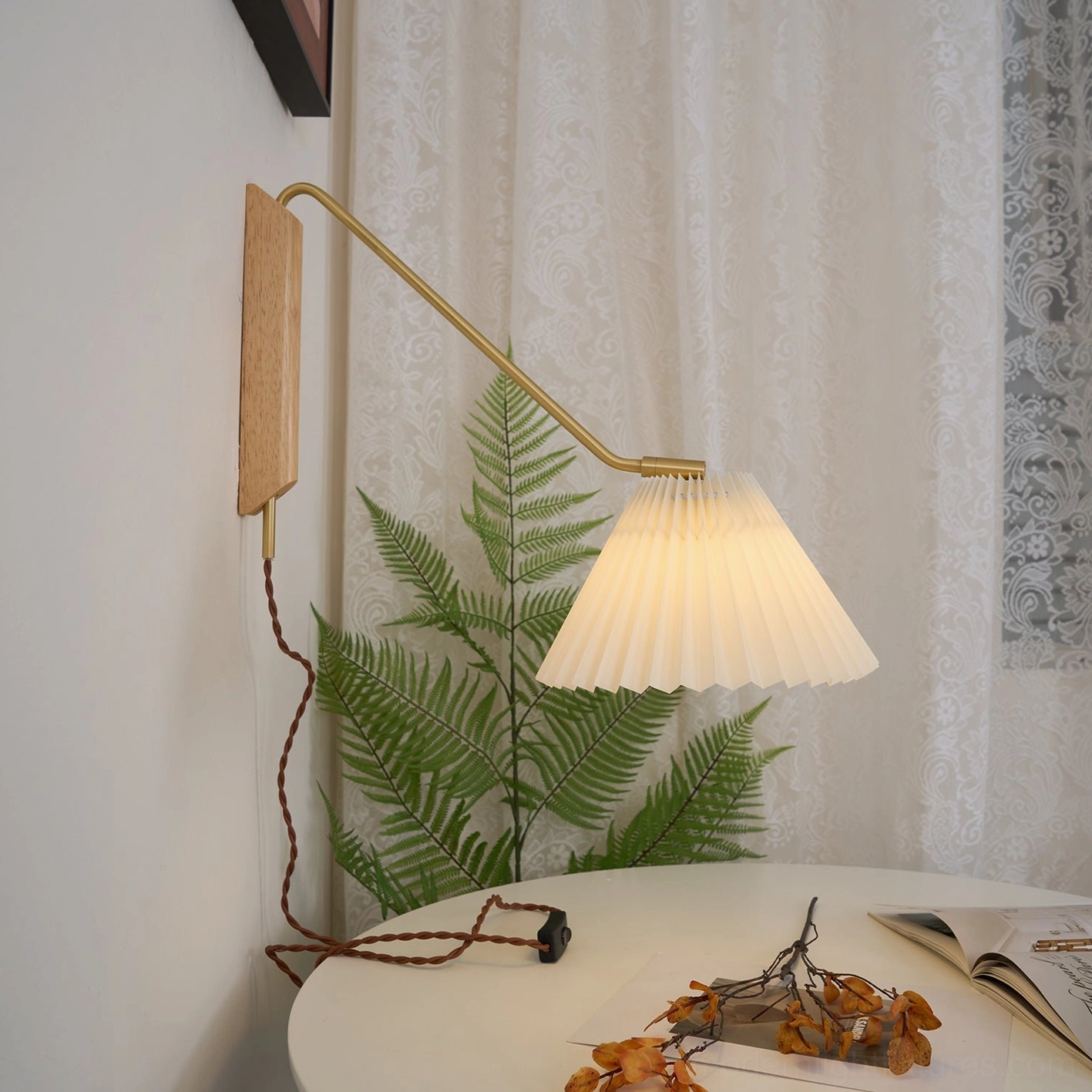 Dorset pleated shade wall lamp in Nordic minimalist dining corner with natural wood base