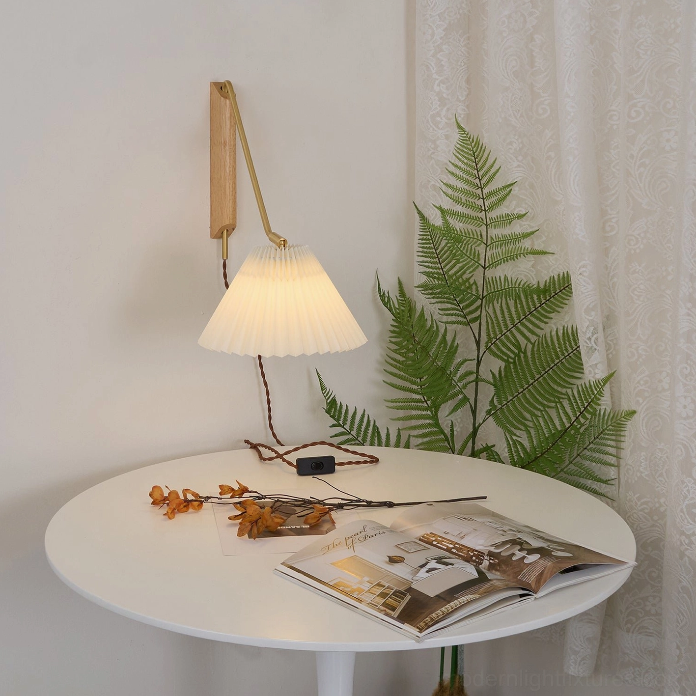 Dorset wall sconce pair installed symmetrically above seating creating layered lighting